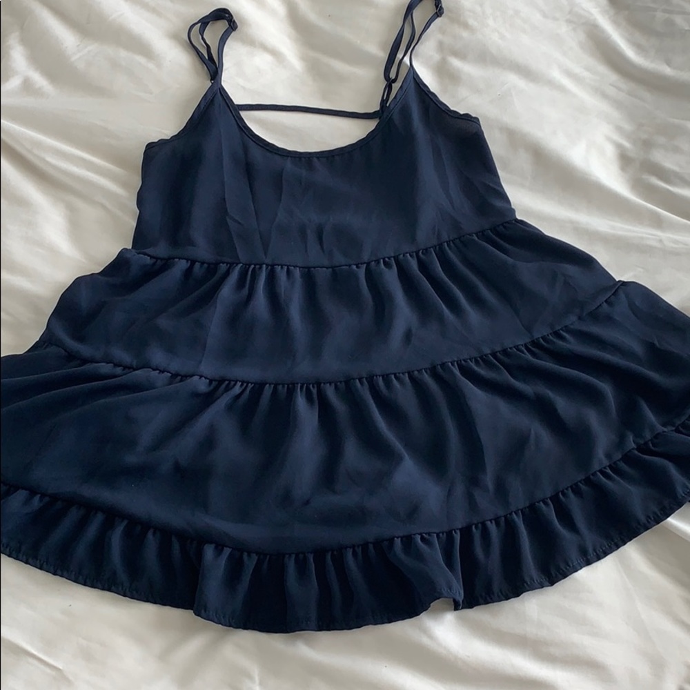 I’m selling a navy blue spaghetti strap shirt.